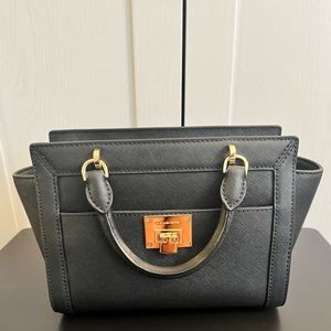 Brand new, never used. Strap in bag. Black and gold Michael Kors Bag. Authentic